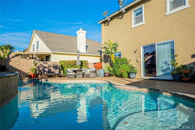 view of pool featuring a patio area and pool water feature