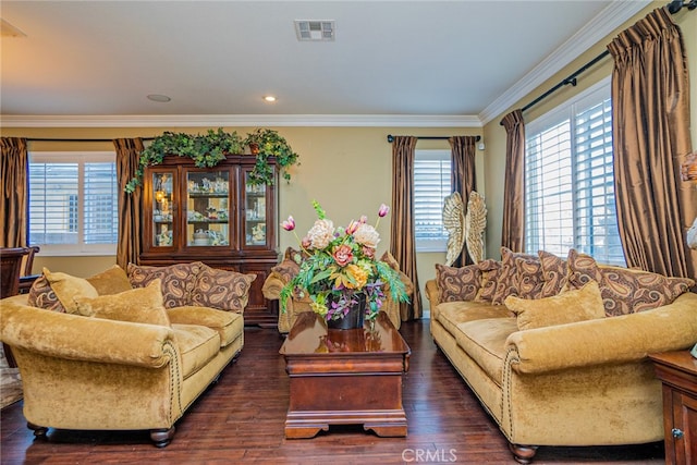 living room featuring dark hardwood / wood-style floors and ornamental molding