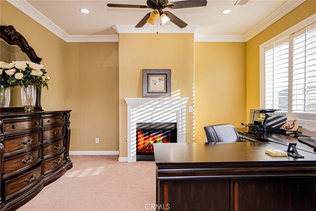 carpeted office space featuring ceiling fan and ornamental molding