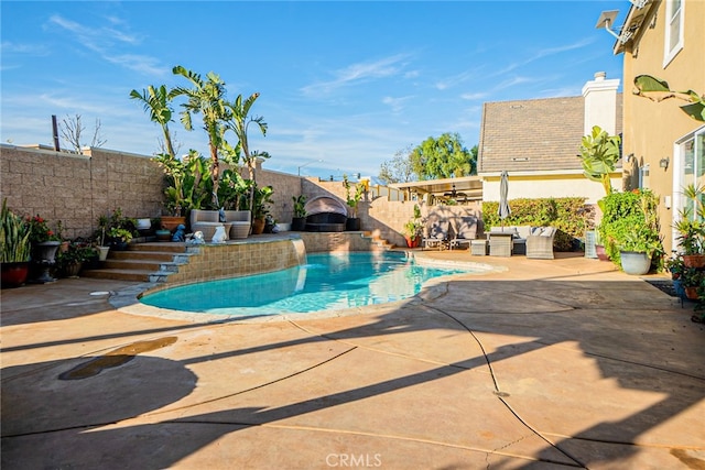 view of swimming pool with a patio