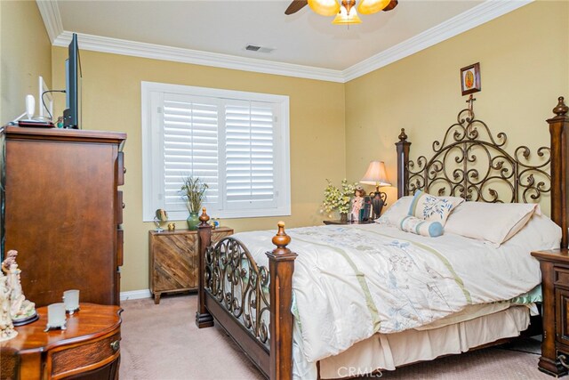 bedroom with ceiling fan, light colored carpet, and ornamental molding