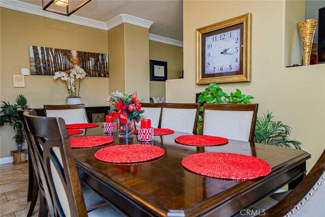 dining room featuring ornamental molding