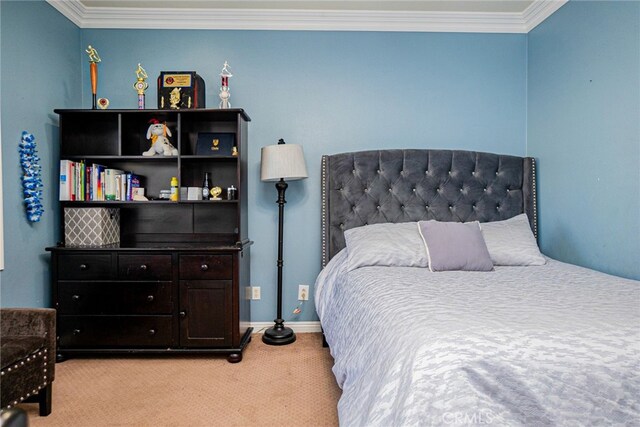 carpeted bedroom with ornamental molding