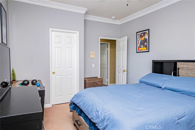 bedroom with carpet and crown molding