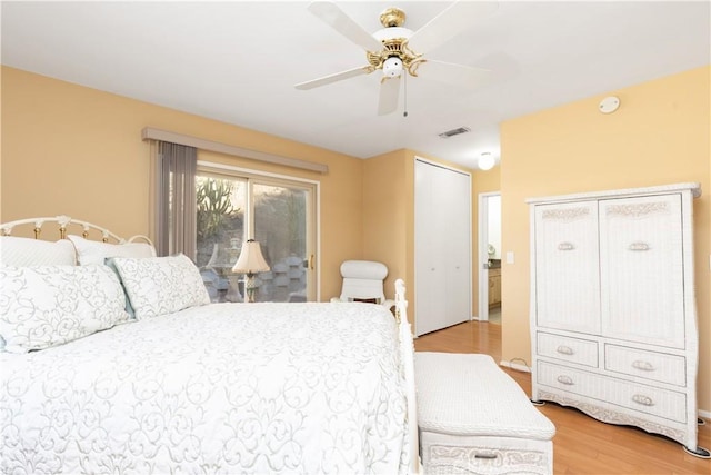 bedroom with access to outside, light hardwood / wood-style flooring, and ceiling fan