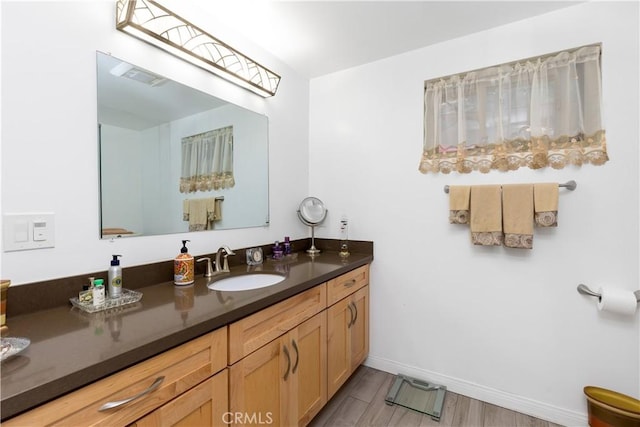 bathroom featuring wood-type flooring and vanity