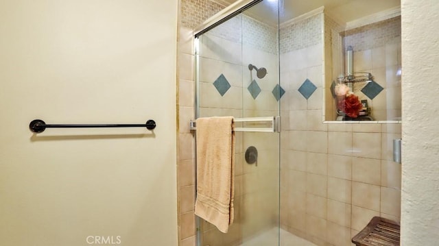 bathroom with a shower with shower door