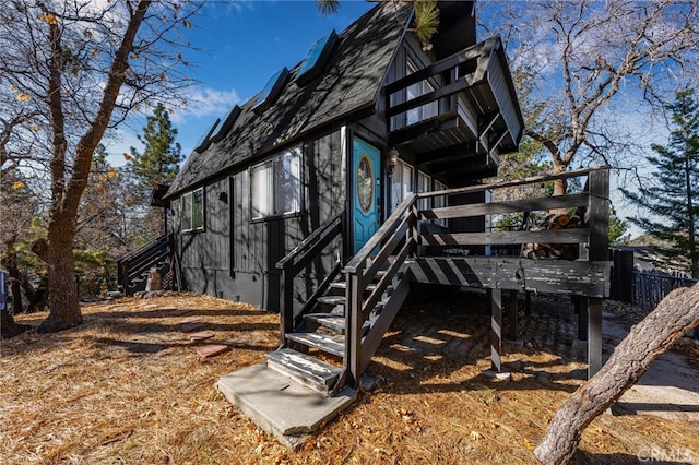 view of side of home featuring a deck