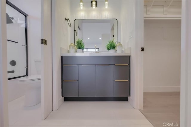 bathroom with toilet and vanity