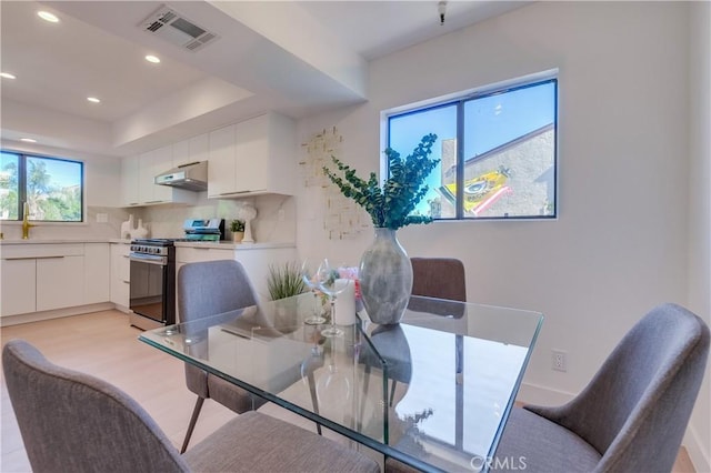 dining space with a tray ceiling