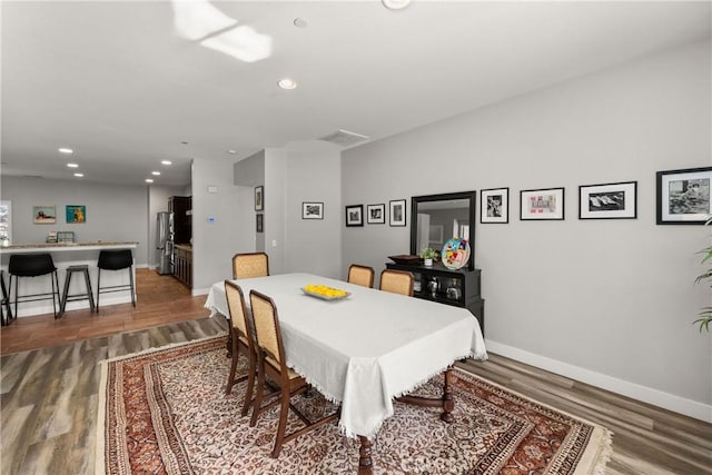 dining area featuring hardwood / wood-style floors