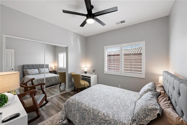 bedroom with ceiling fan, hardwood / wood-style floors, and a closet