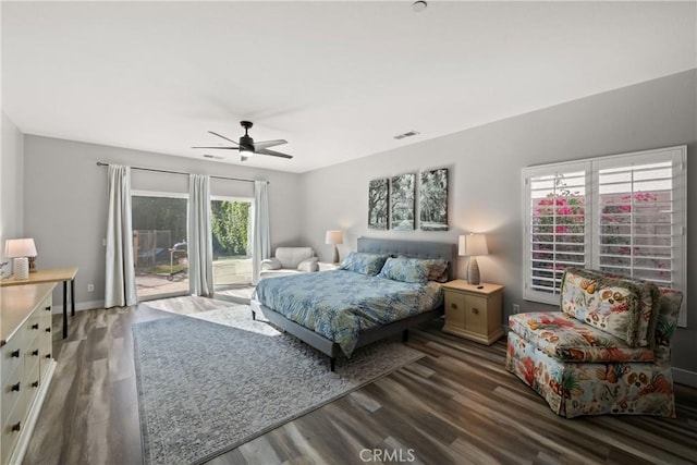 bedroom with ceiling fan, dark hardwood / wood-style floors, and access to outside