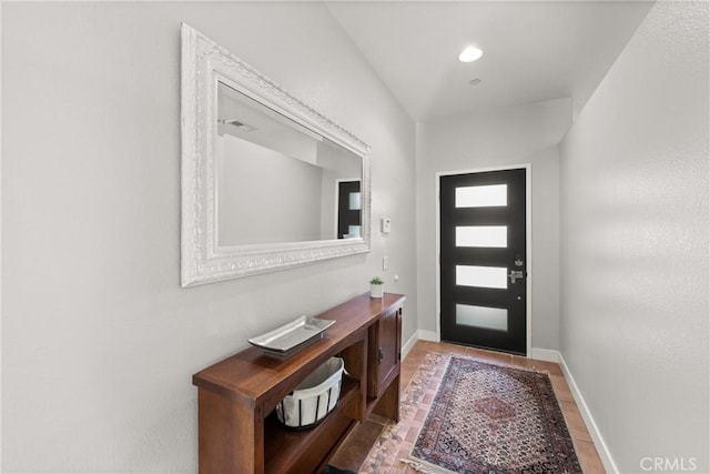 entryway featuring light tile patterned floors