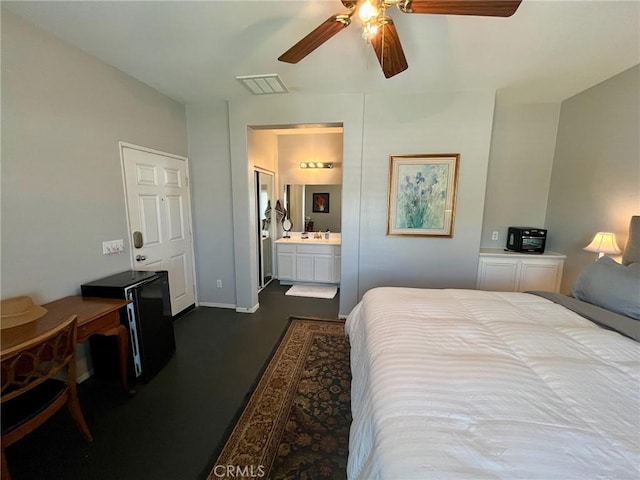 bedroom with connected bathroom, ceiling fan, and a closet