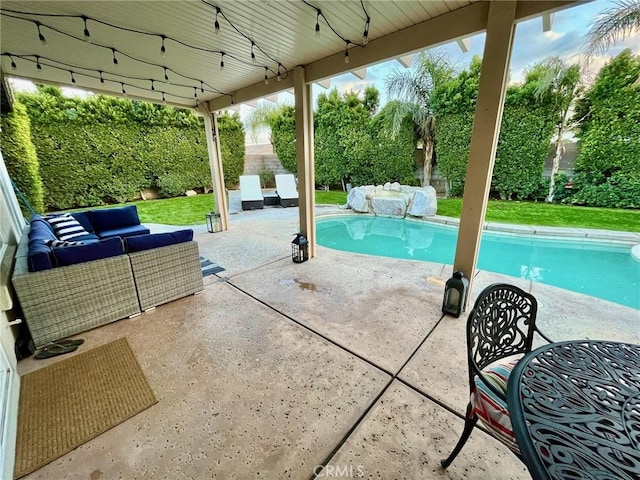 view of swimming pool with an outdoor living space and a patio area