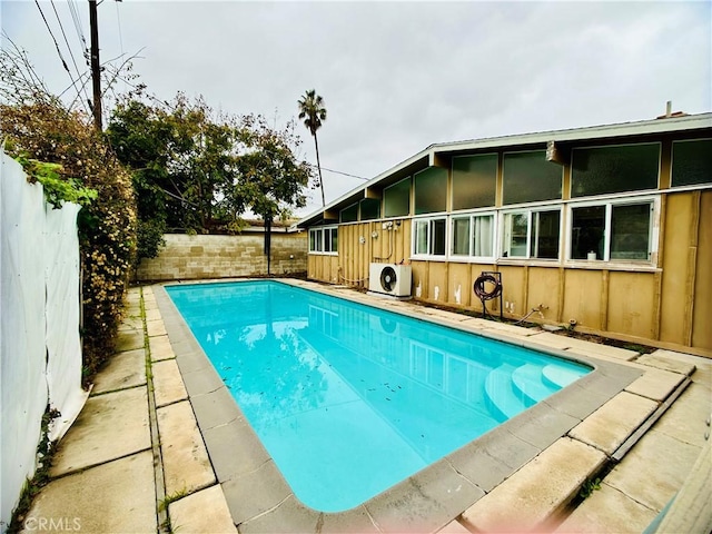 view of pool featuring ac unit