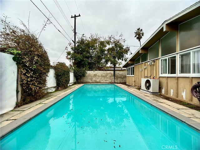 view of swimming pool featuring ac unit