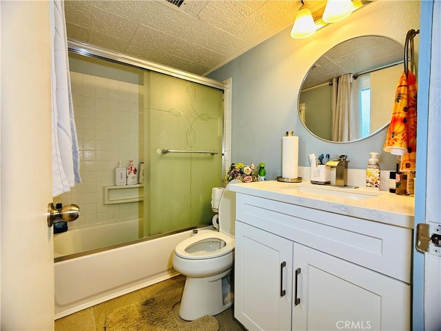 full bathroom with toilet, bath / shower combo with glass door, tile patterned floors, and vanity