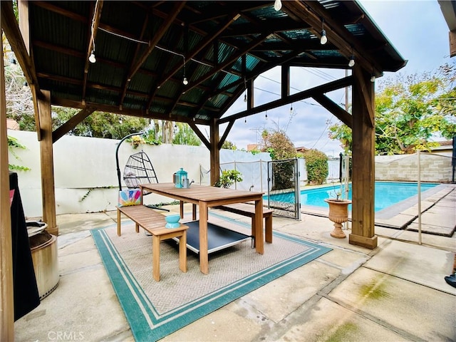 view of patio / terrace with a gazebo and a fenced in pool