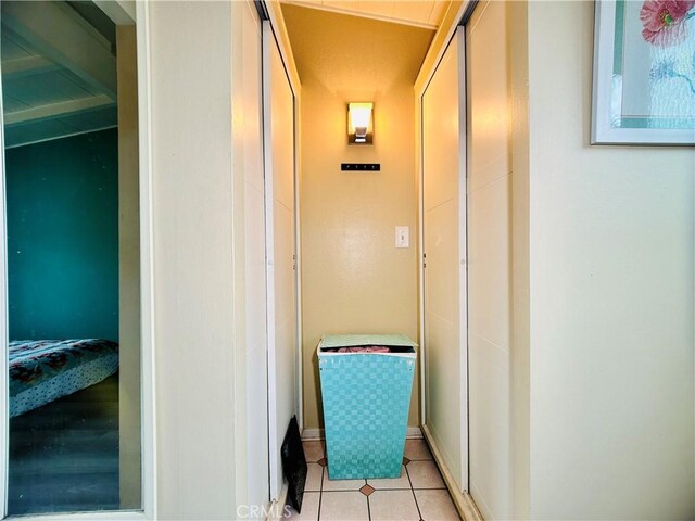 corridor with light tile patterned floors