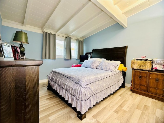 bedroom with light hardwood / wood-style flooring and vaulted ceiling with beams