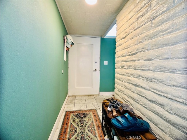 hall with light tile patterned floors