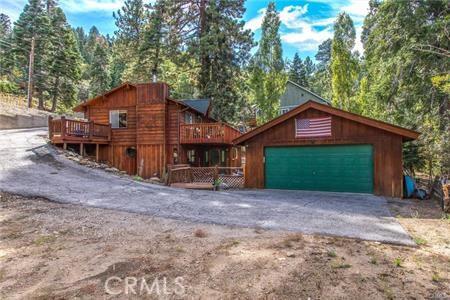 view of front of house with a garage and a wooden deck