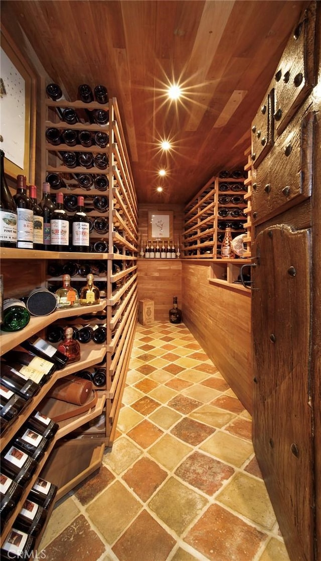 1330 Temple Hills Dr, Laguna Beach, CA 92651 - wine area with wood ceiling, light stone finish flooring, and wood walls