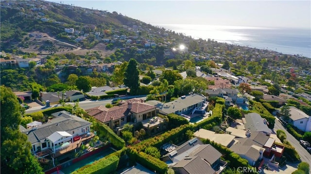 drone / aerial view with a water view and a residential view