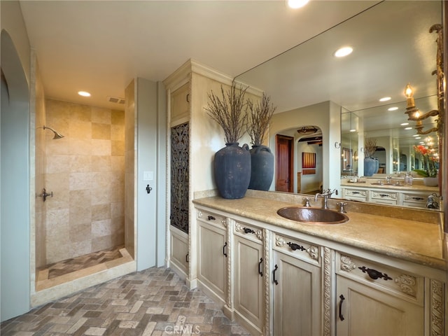 1330 Temple Hills Dr, Laguna Beach, CA 92651 - full bath with a tile shower, recessed lighting, vanity, and brick floors