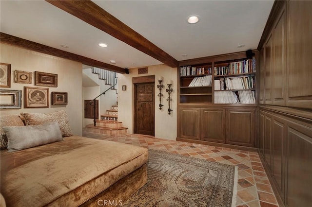 interior space featuring visible vents, beam ceiling, recessed lighting, and stairway