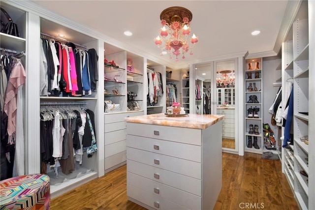 1330 Temple Hills Dr, Laguna Beach, CA 92651 - spacious closet featuring wood finished floors and a chandelier