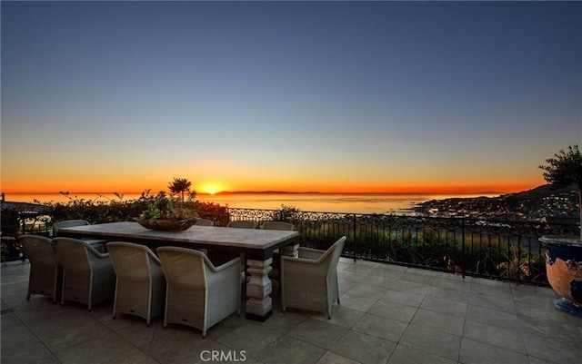 view of patio / terrace featuring a water view and outdoor dining area