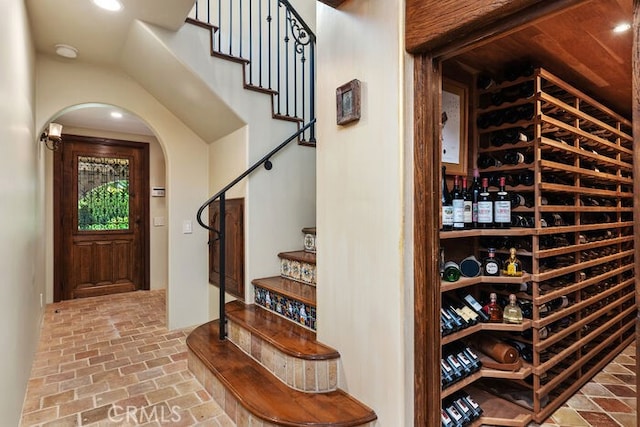 1330 Temple Hills Dr, Laguna Beach, CA 92651 - wine cellar featuring brick floors, arched walkways, and recessed lighting