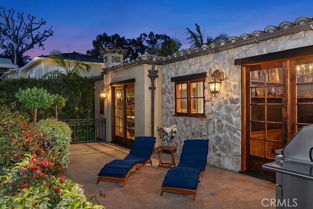 1330 Temple Hills Dr, Laguna Beach, CA 92651 - patio terrace at dusk with a grill and a patio area