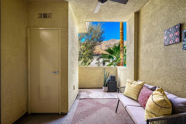 balcony featuring ceiling fan