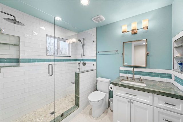 full bathroom with visible vents, toilet, a stall shower, recessed lighting, and vanity