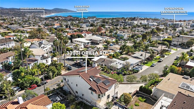 bird's eye view with a residential view and a water view