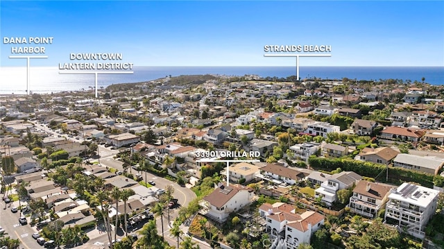 bird's eye view featuring a water view and a residential view