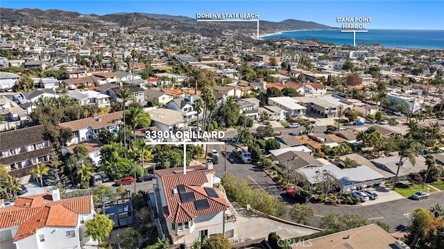 bird's eye view with a residential view and a water and mountain view