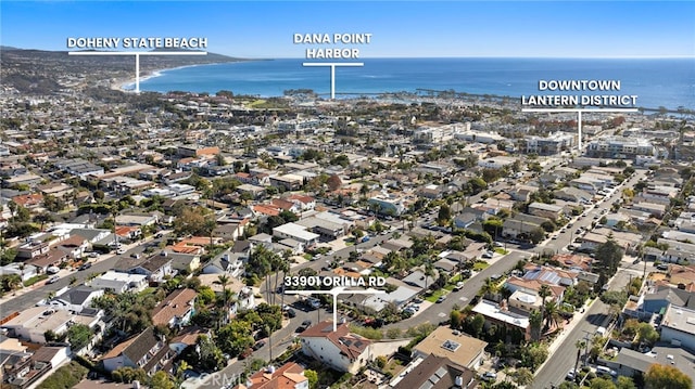 birds eye view of property featuring a residential view and a water view