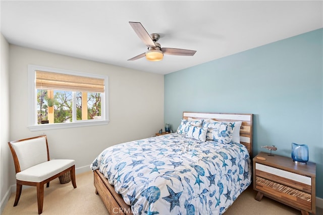 bedroom featuring ceiling fan and light carpet