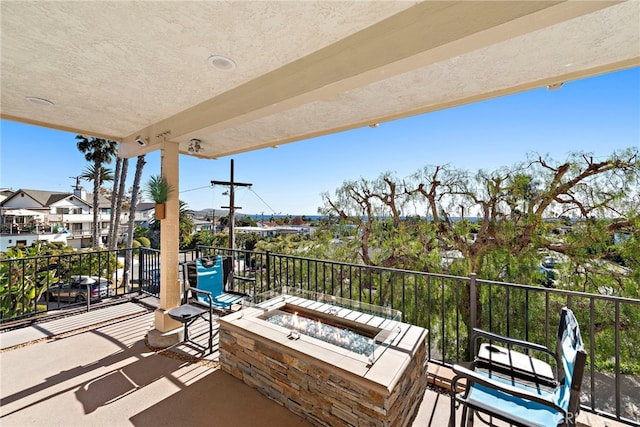 balcony with an outdoor fire pit