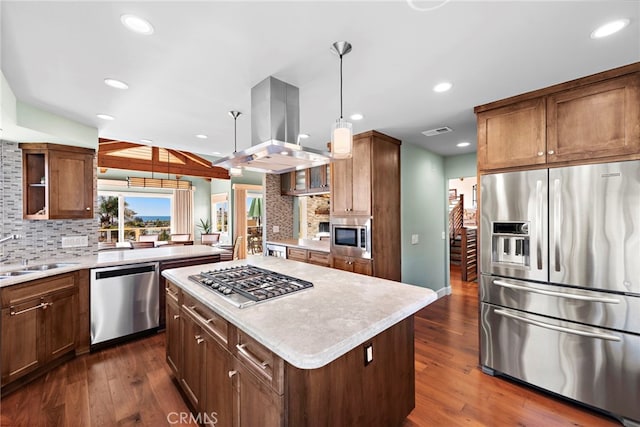 kitchen with open shelves, island exhaust hood, a sink, stainless steel appliances, and dark wood-type flooring