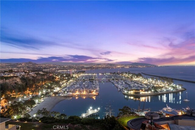 aerial view at dusk with a water view