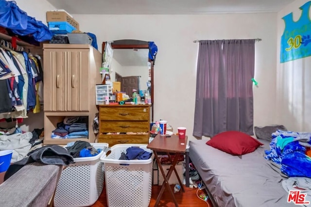 bedroom with wood-type flooring