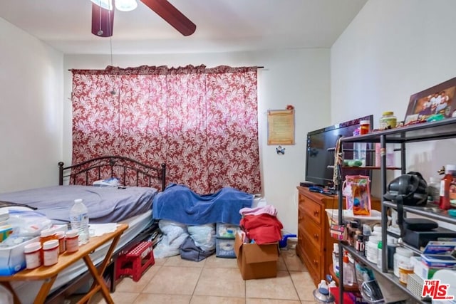 bedroom featuring ceiling fan and light tile patterned floors