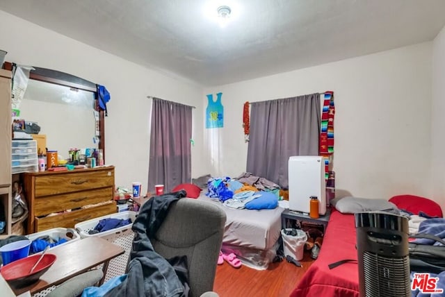 bedroom featuring wood-type flooring