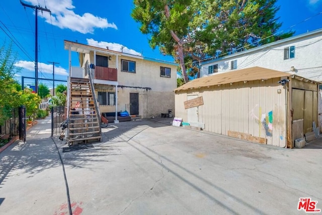 back of property with a patio area